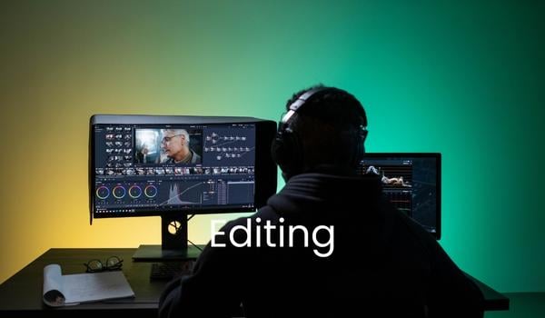 Picture of video editor behind computer