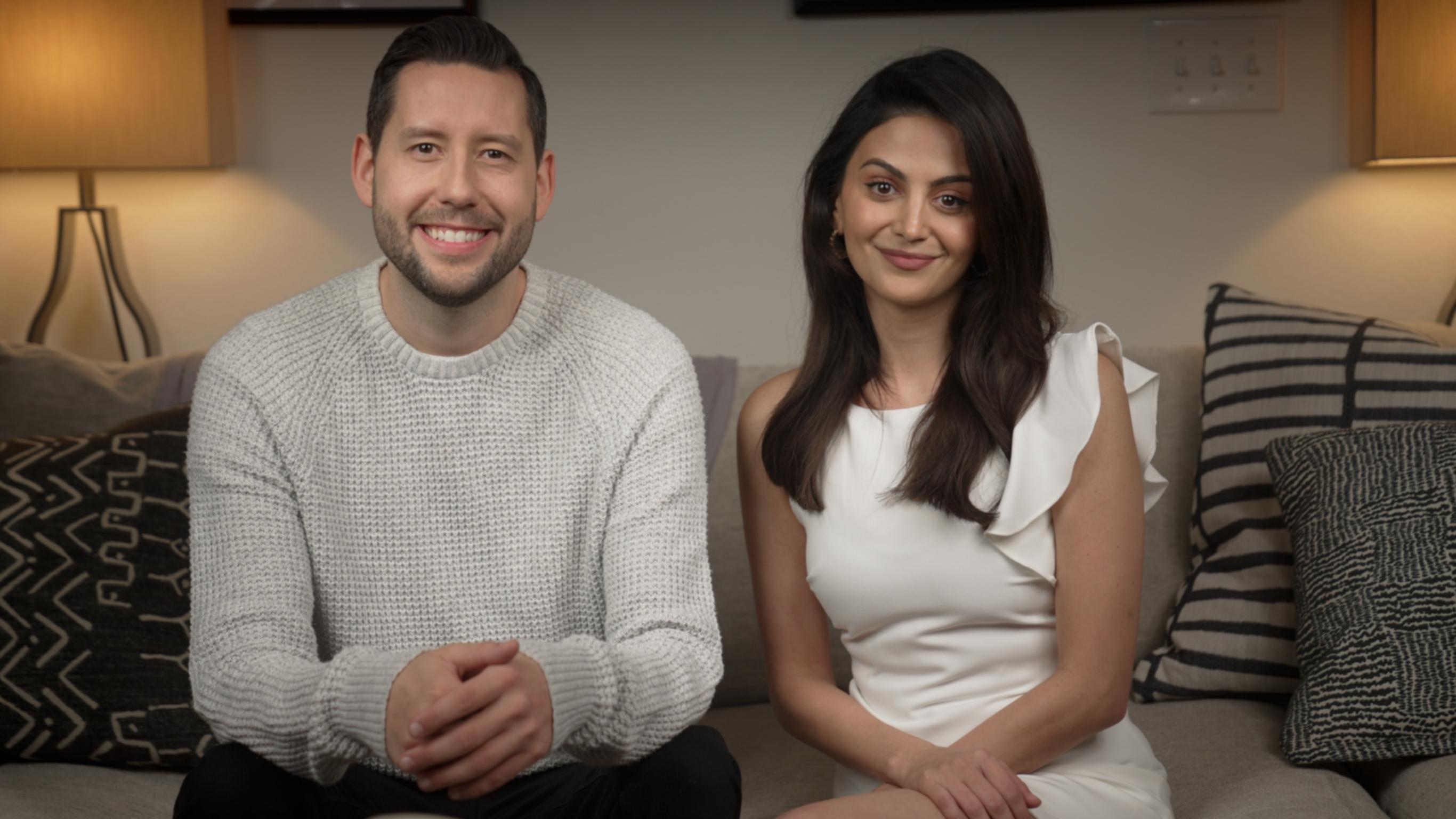 Dashti Media co-founders Nate Barrett and Kezhal Dashti sitting and smiling in their living room set.